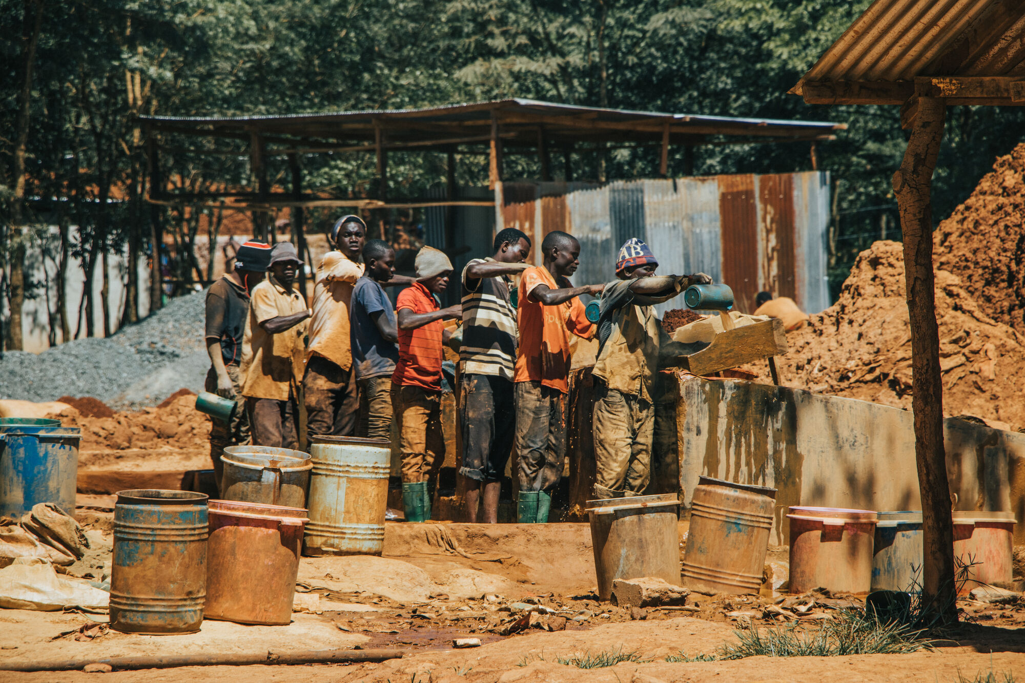 Miners washing ore at an artisanal gold processing site
